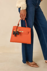 Reign It In Orange Faux Leather Twist Lock Handbag