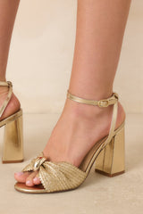 Charmed I'm Sure Gold Woven Bow Block Heel Sandals