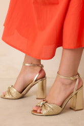 Charmed I'm Sure Gold Woven Bow Block Heel Sandals