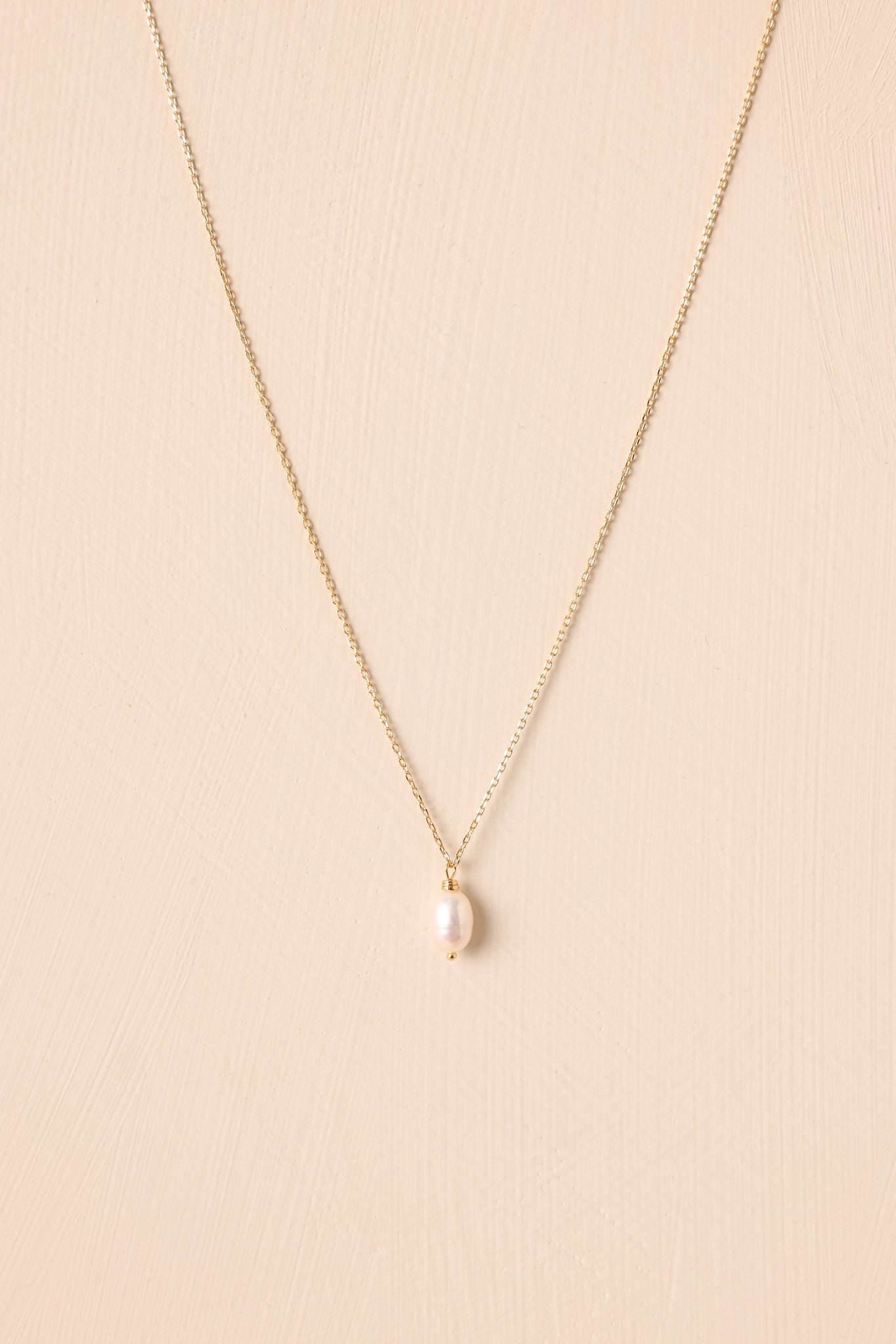 A Brighter Perspective Gold Ivory Pearl Necklace