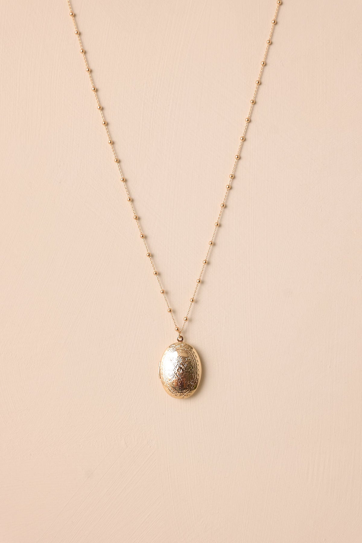 On Repeat Gold Locket Necklace