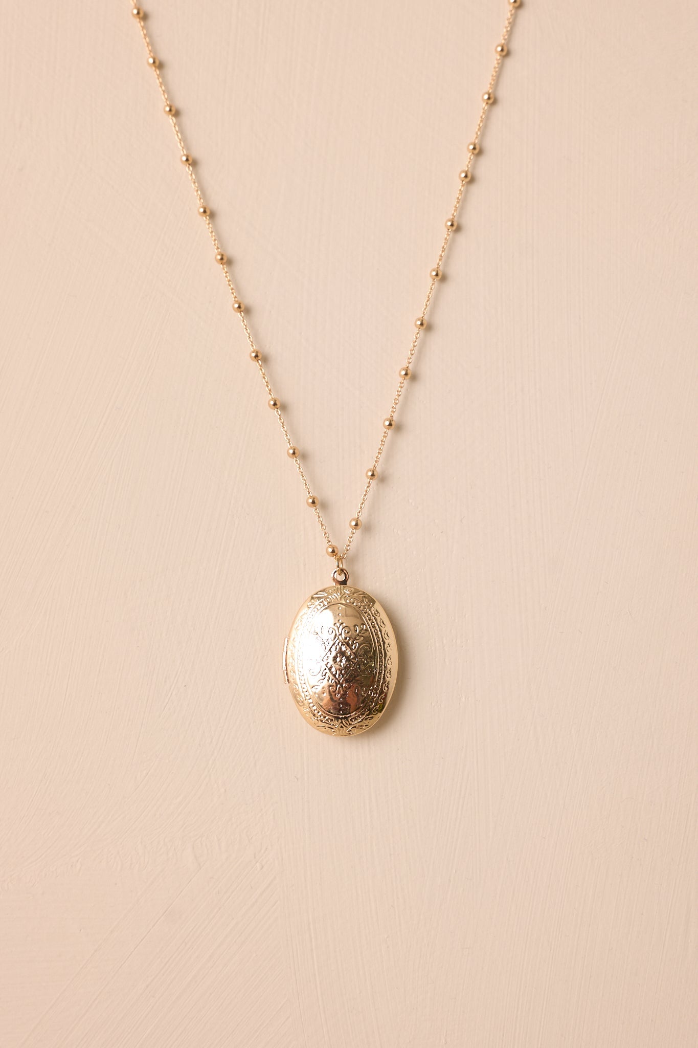 On Repeat Gold Locket Necklace