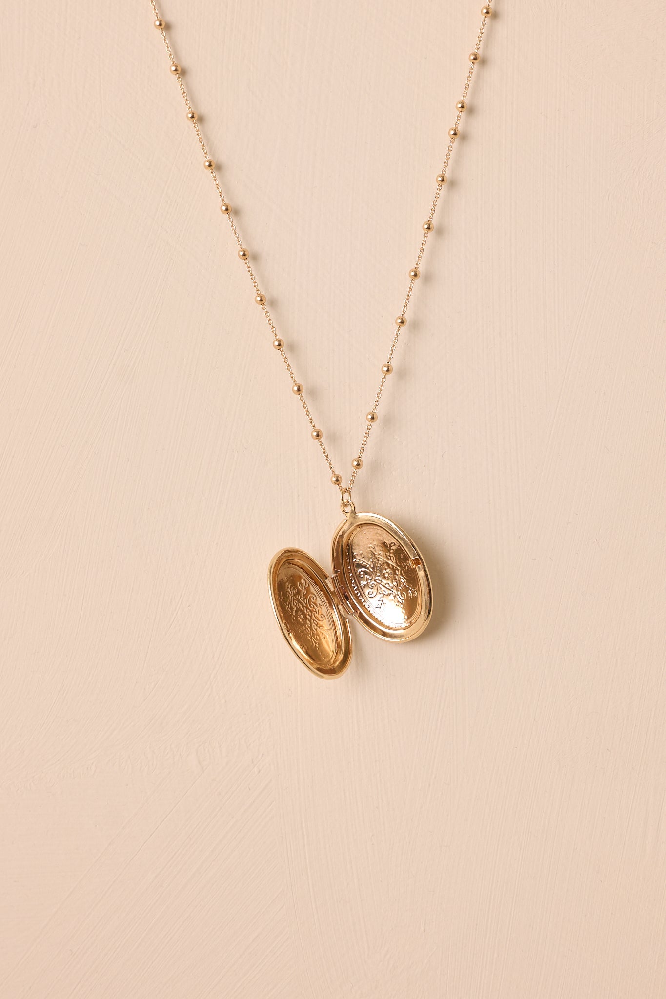 On Repeat Gold Locket Necklace