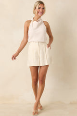 Effortlessly Refined Light Beige Draped Neck Gold Accent Sleeveless Top