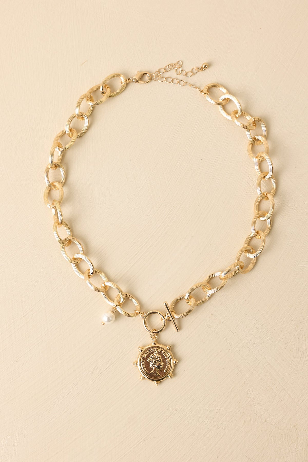 A Regal Traveller Gold Charm Statement Chain Necklace