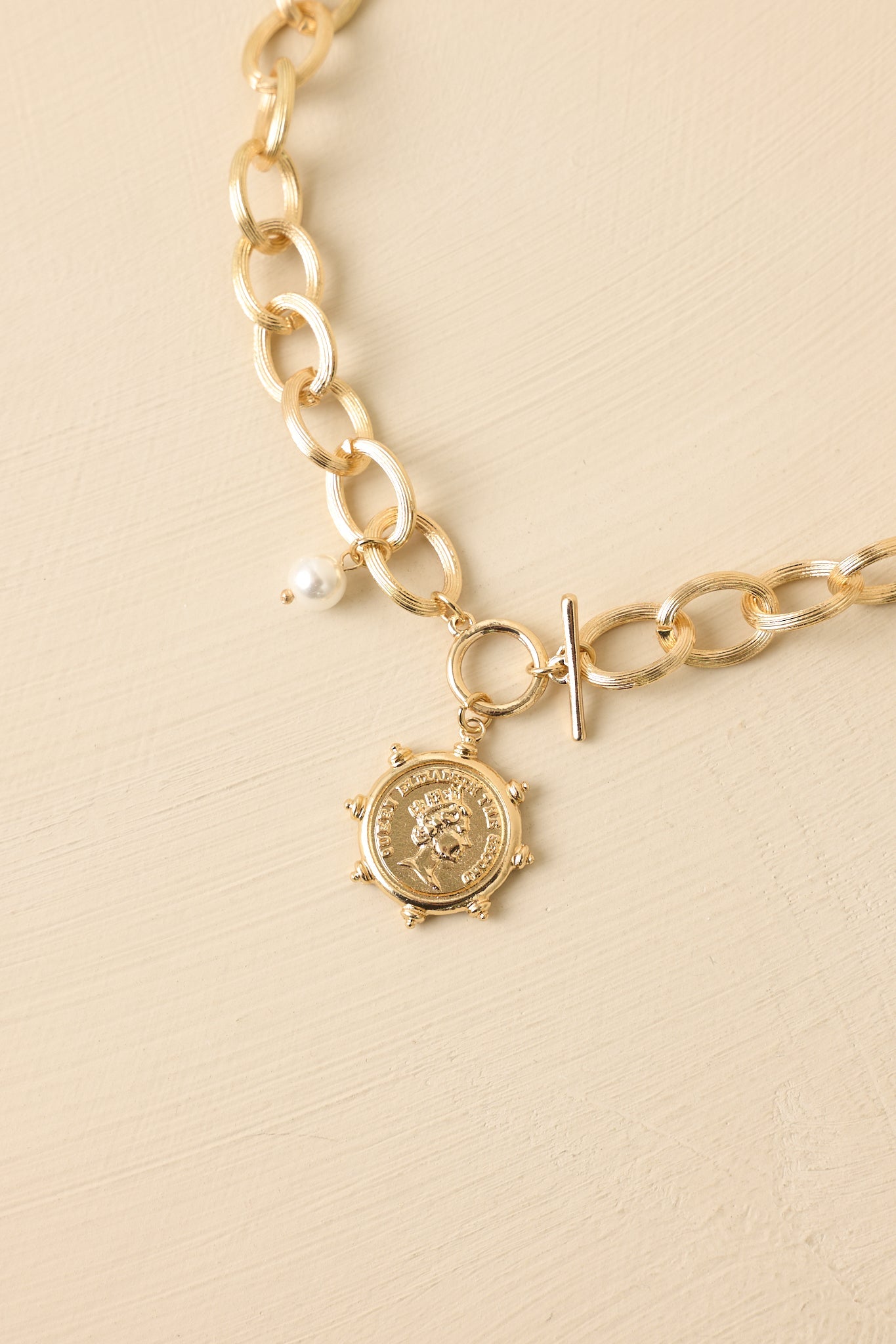 A Regal Traveller Gold Charm Statement Chain Necklace