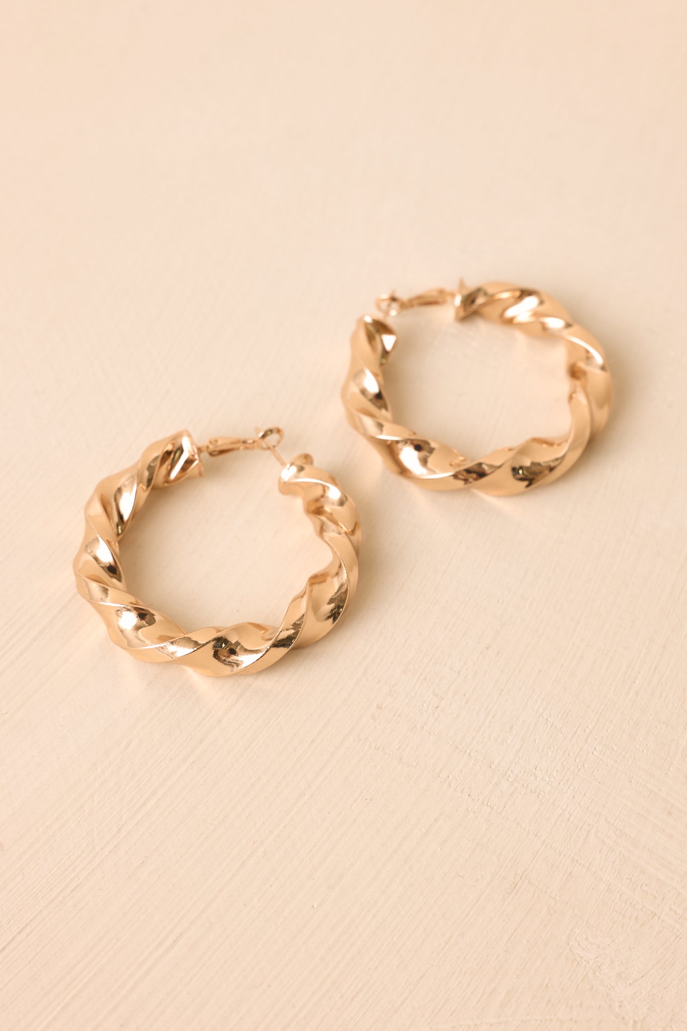 Twist of Fate Gold Sculptural Hoop Earrings