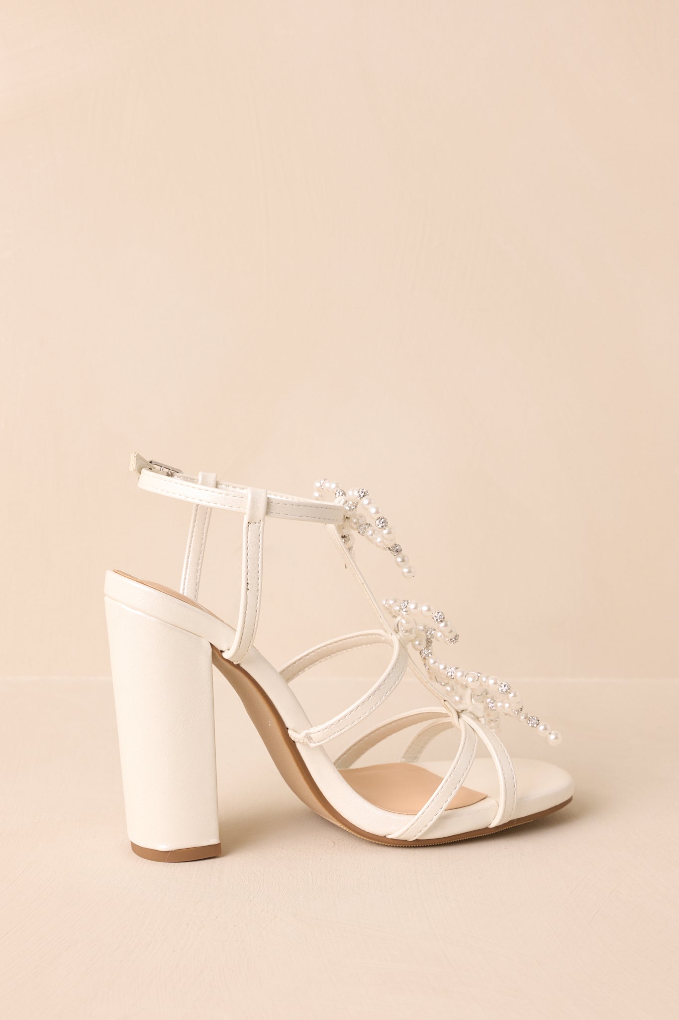 Reaching Higher Ivory Pearl Bow Front Ankle Strap Heels