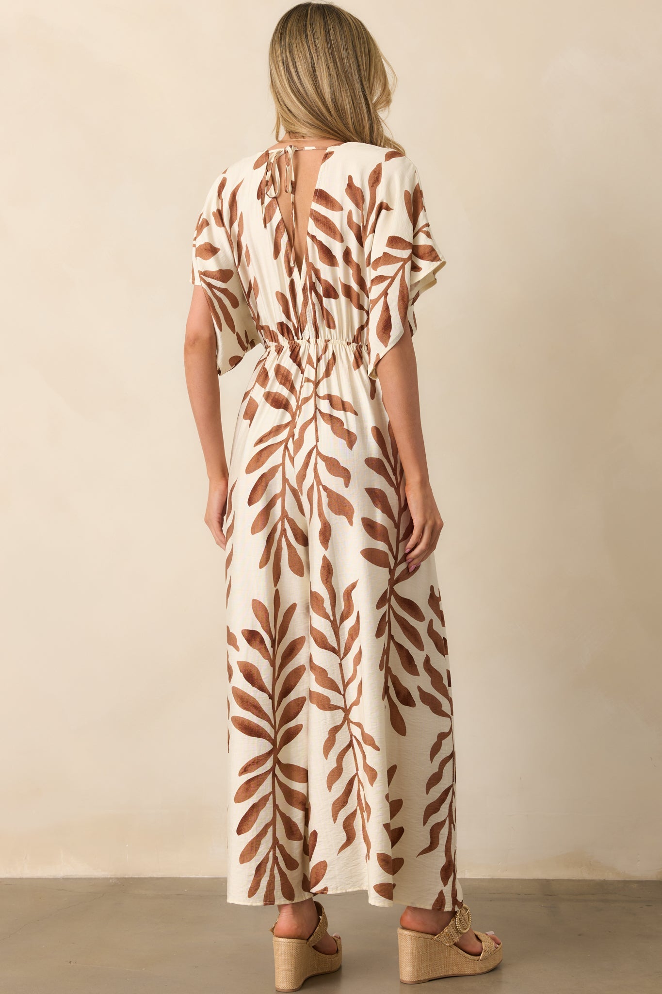 Stepping Into Greatness Light Brown Botanical Print Jumpsuit