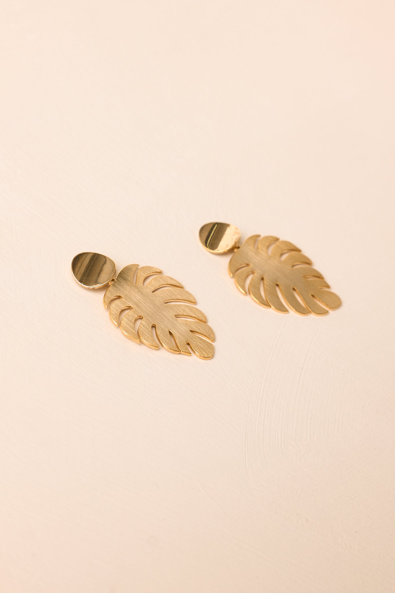 A Radiant Escape Gold Palm Leaf Drop Earrings