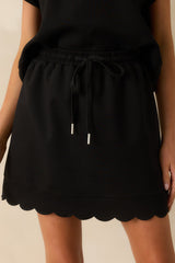 In Passing Black Cotton Scallop Hem Drawstring Mini Skirt