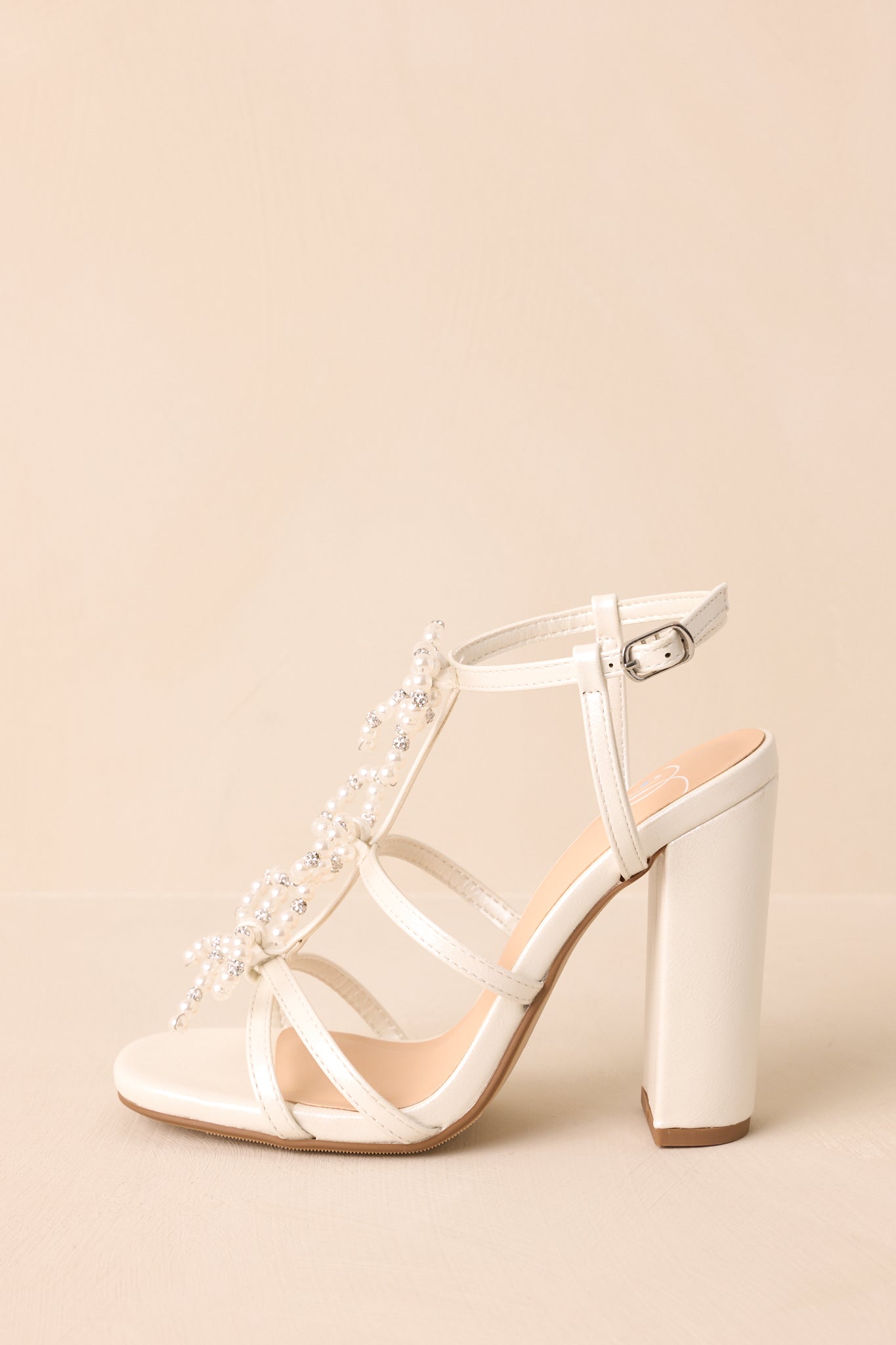 Reaching Higher Ivory Pearl Bow Front Ankle Strap Heels