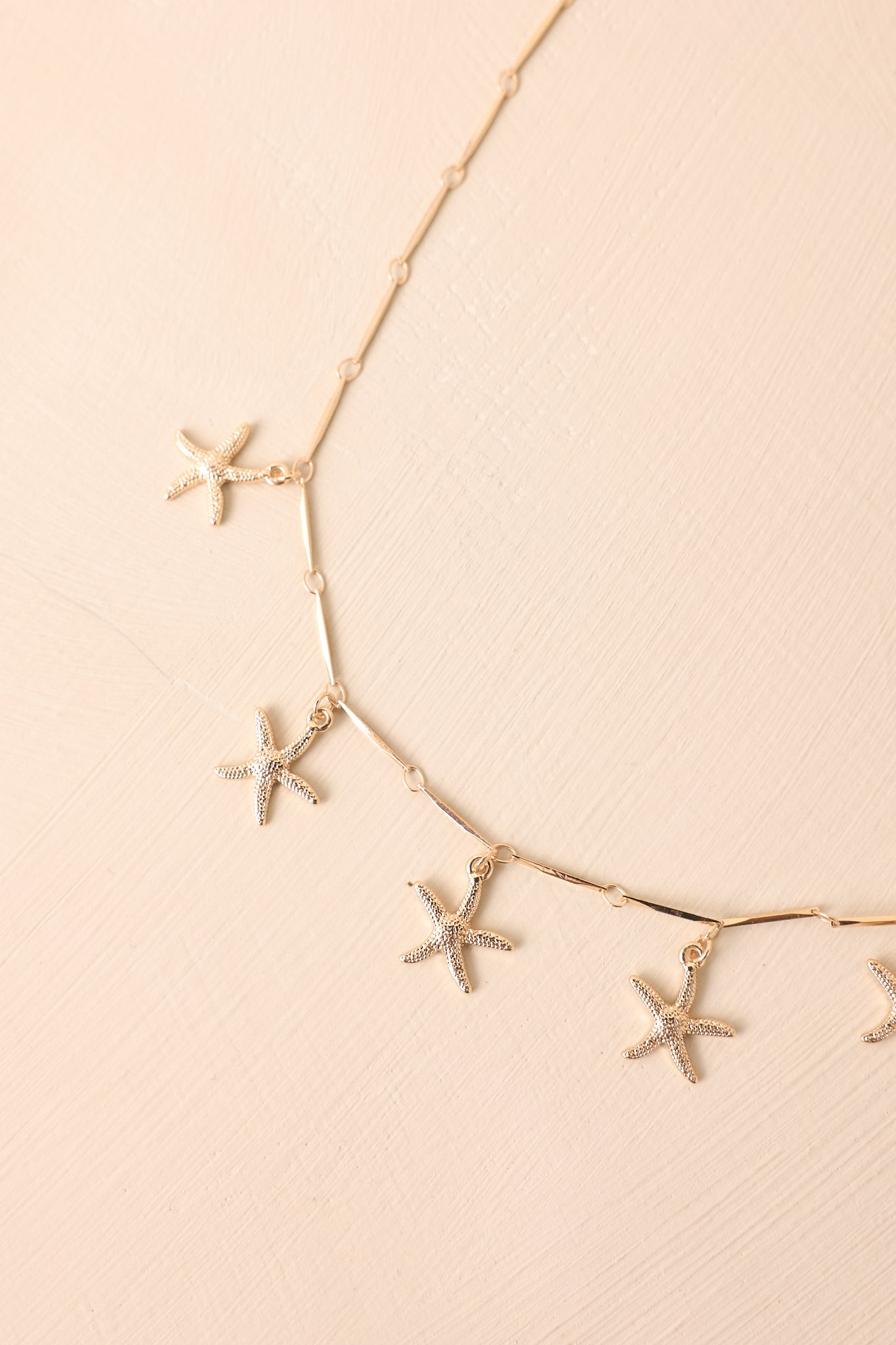 Coasting With Confidence Gold Textured Starfish Charm Necklace