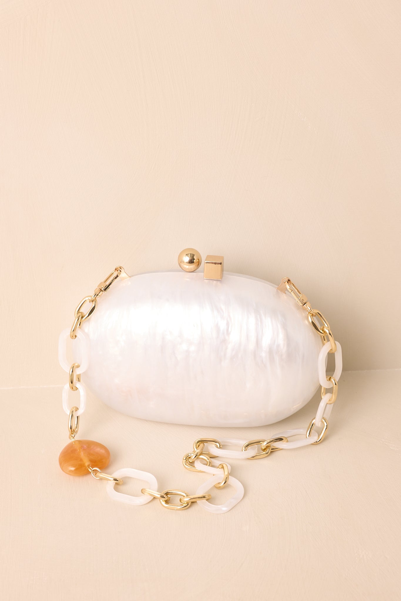 Worth Remembering Ivory Pearlescent Rounded Clutch Bag