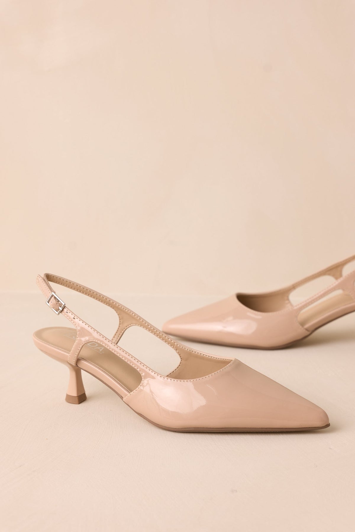 Fiercely Stunned Nude Patent Kitten Heels