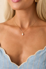 A Brighter Perspective Gold Ivory Pearl Necklace